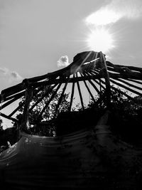 Low angle view of sunlight against sky