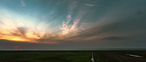 Scenic view of landscape against sky during sunset