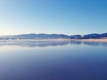 Scenic view of calm sea against clear sky