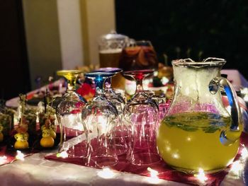 Close-up of drink in glass jar on table with appetizer and food