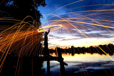Light trails against sky at night
