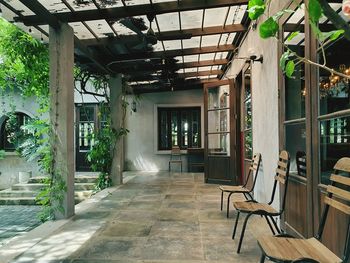 Empty chairs and table in building