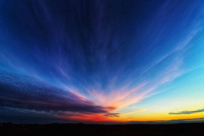 Low angle view of dramatic sky at sunset