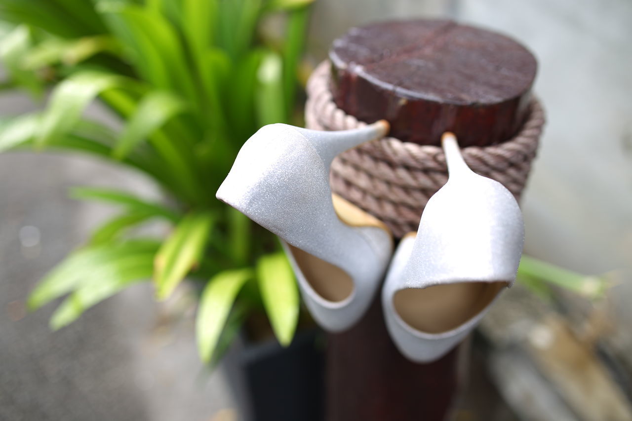 CLOSE-UP OF HAT ON PLANTS