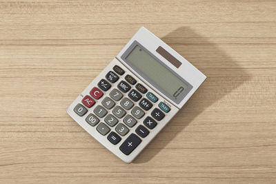 High angle view of calculator on table