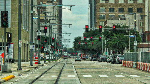 Vehicles on road along buildings