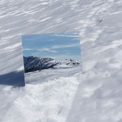 Scenic view of snowcapped mountain against sky