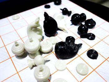 High angle view of chess pieces on table