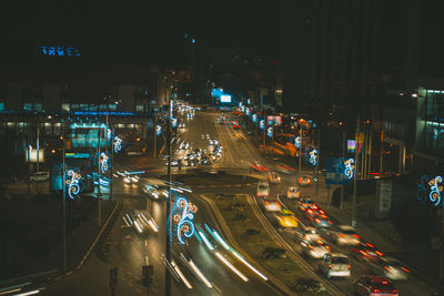 High angle view of illuminated city street at night