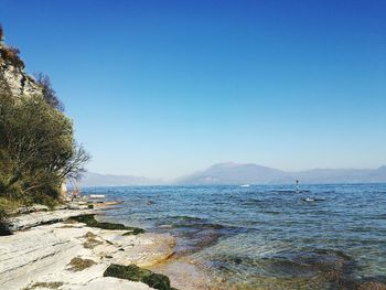 Scenic view of sea against clear blue sky