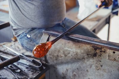 Close-up of hand making sculptures of glass