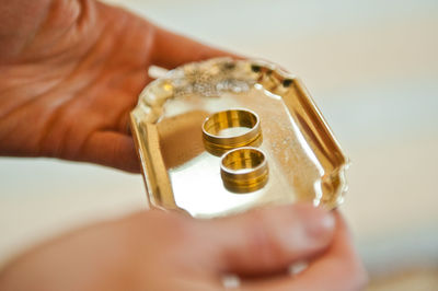 Close-up of man holding cup