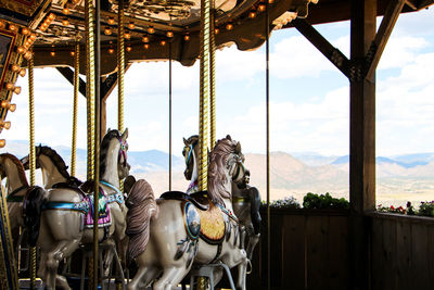 Cropped merry-go-round against the sky
