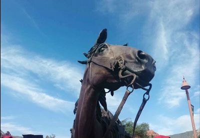 Low angle view of building against cloudy sky