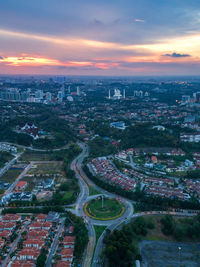 High angle view of buildings against sky during sunset