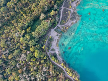 Aerial view of sea by landscape