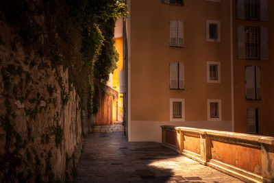 Empty alley amidst buildings