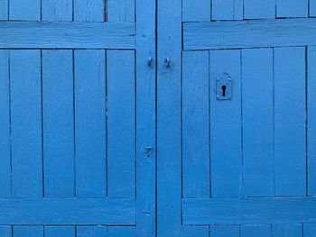 Full frame shot of closed wooden door blue a