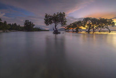 Scenic view of lake against sky during sunset