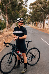 Man riding bicycle on road