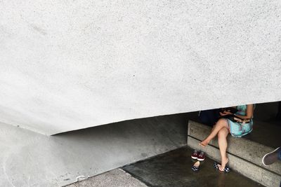 Woman standing against wall