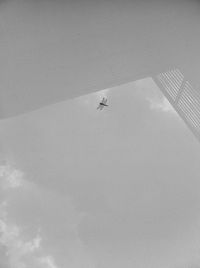 Low angle view of airplane in sky