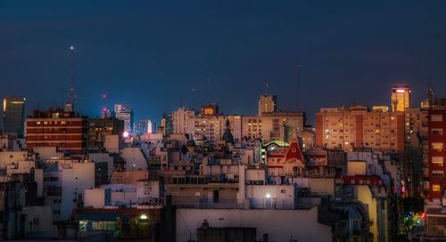 Buildings in city at night