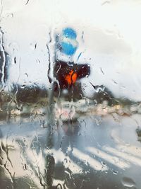 Full frame shot of wet glass window in rainy season