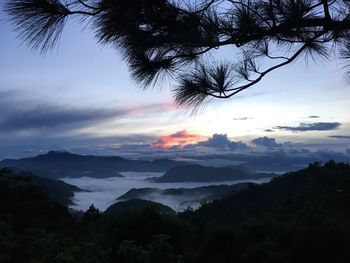 Scenic view of landscape against sky at sunset