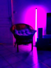 Illuminated purple chair at home