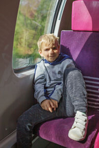 Portrait of boy sitting in car