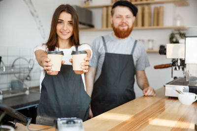 Woman holding coffee cup