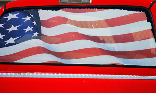 Close-up of flag against blue sky