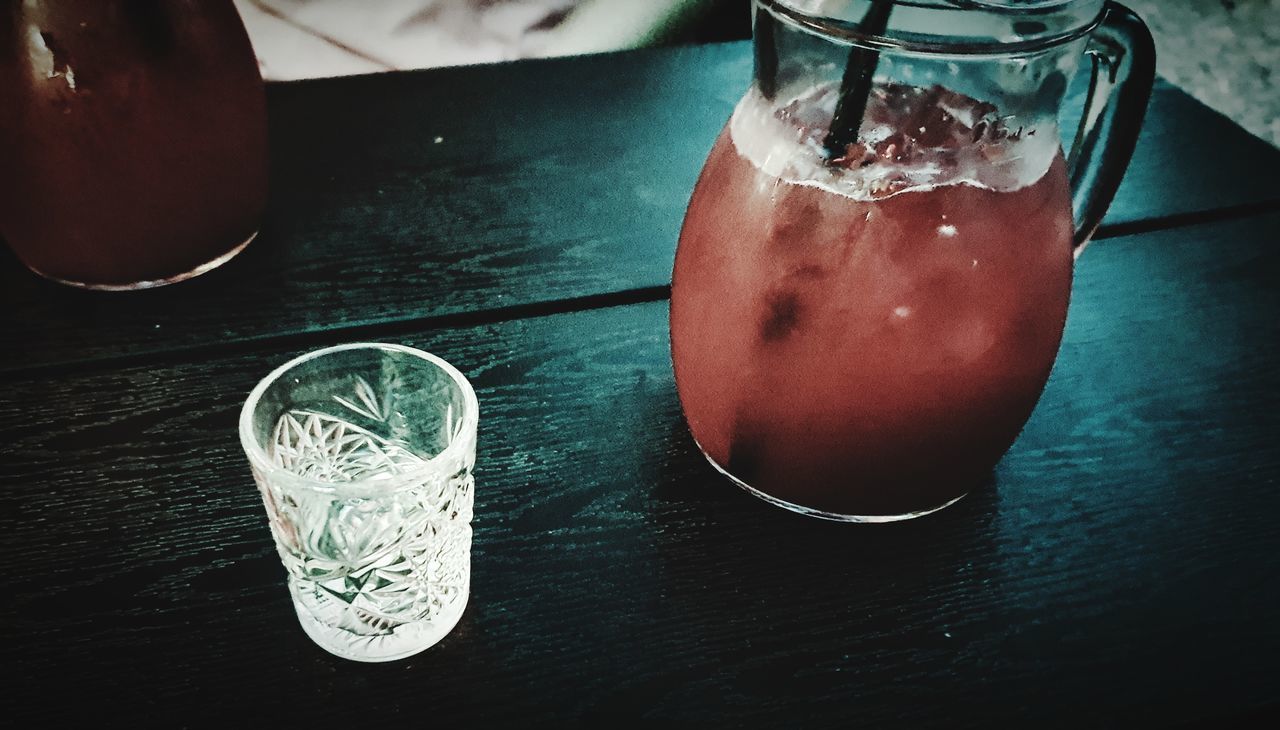 CLOSE-UP OF DRINK ON TABLE