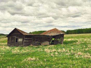 House on field against sky