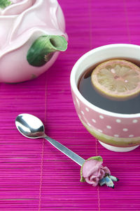 Close-up of lemon tea served on table