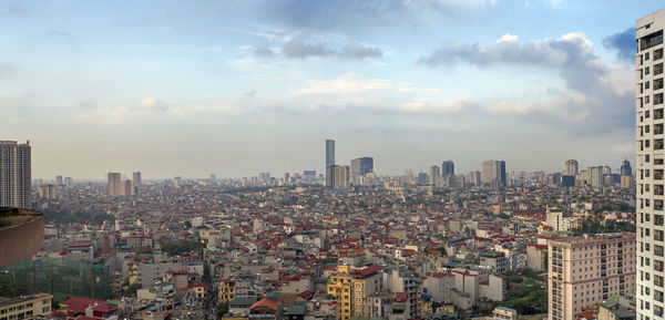 Aerial view of modern buildings in city against sky