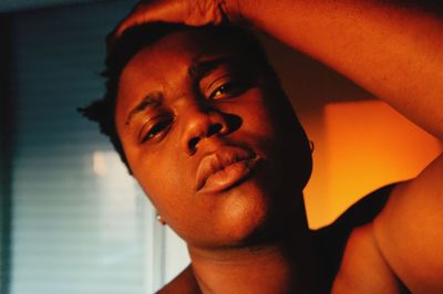 Close-up portrait of young man at home