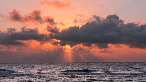 Scenic view of sea against sky during sunset