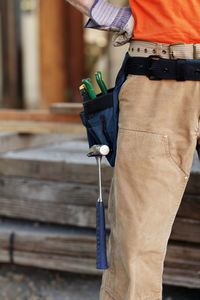 Closeup of male constructcion worker wearing tool belt