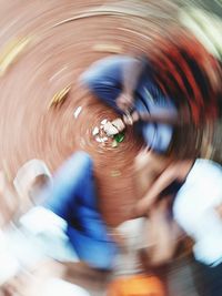 Blurred motion of people in amusement park