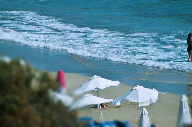 water, sea, beach, nature, white color, beauty in nature, day, tranquility, focus on foreground, outdoors, horizon over water, high angle view, tranquil scene, shore, no people, sunlight, scenics, blue, close-up, selective focus