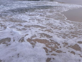 High angle view of surf on beach