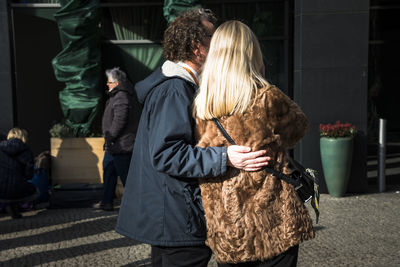 Rear view of couple standing outdoors