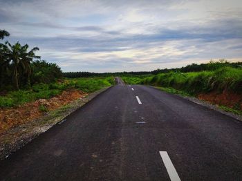 Empty road against sky