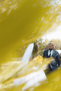 Portrait of man standing in yellow water