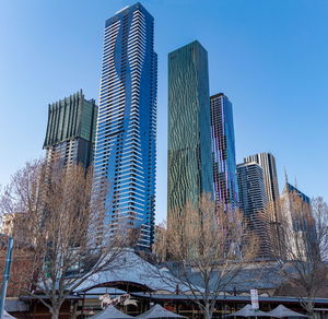 Low angle view of modern buildings against clear sky