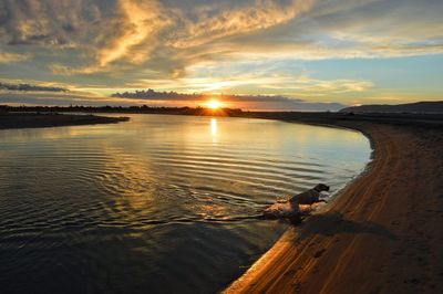 View of lake against sky during sunset