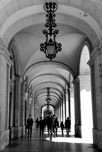 People walking in building corridor