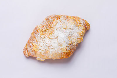 Close-up of bread against white background